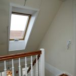 Velux style window with electric opener on a landing